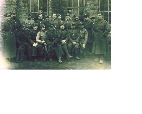 Photo of Stanislaw Sys (Virtuti Militari) (front centre with moustache and legs crossed) and cousin Bronislaw Stanislaw Sys (directly behind at the back facing right) taken after registering with the Red Cross in Lithuania in 1939 prior to being arrested by the Soviets.